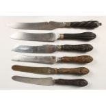 SIX KNIVES with carved wood handles.