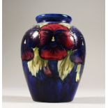 A VASE, with the pansy design, on a blue ground, 1920's-1930's. 4ins high.