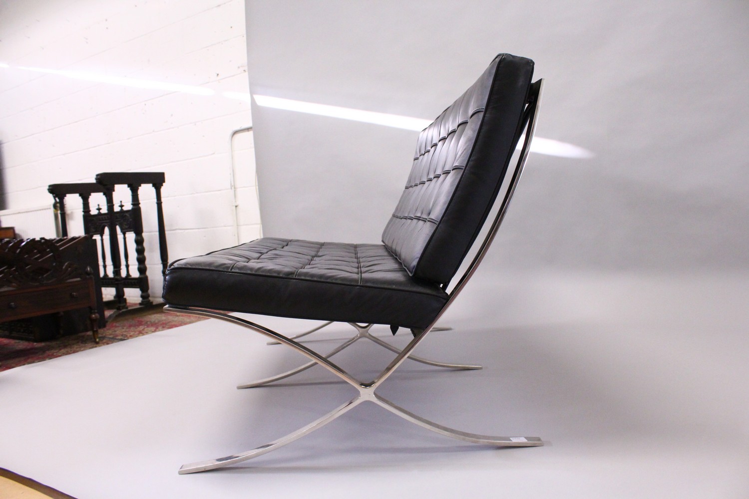 MIES VAN DER ROHE, A BARCELONA SETTEE, with button upholstered black leather back and seat cushions, - Image 3 of 5