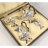 A GOOD EDWARD VII FOUR PIECE SILVER TEA SET, in a leather case. Birmingham 1906. Maker: L. & S.