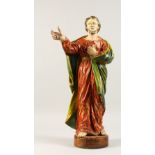 AN 18TH CENTURY ITALIAN CARVED WOOD AND GILDED SAINT, right hand held aloft. 1ft 11ins high.