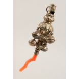 A CHILD'S VICTORIAN SILVER AND CORAL RATTLE. 8.5cms long. Birmingham 1898.