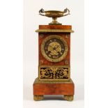 A GOOD EMPIRE MAHOGANY AND GILT METAL CLOCK, with urn finial and eight-day movement. 16ins high.