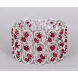 A SUPERB SILVER AND REAL RUBY THREE ROW BRACELET, in a box.