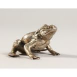 A CAST SILVER MODEL OF A FROG, with diamond eyes. 3.5cms high. Stamped.