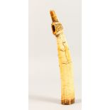 A TRIBAL BONE OLIPHANT, carved with a lizard. 10.5ins long.