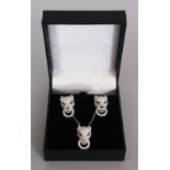 A SILVER PANTHER NECKLACE AND EARRINGS in a box.