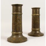 A PAIR OF 18TH CENTURY OR EARLIER ISLAMIC PERSIAN SAFAVID TORCH STANDS, with nine sides, calligraphy