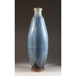 A LARGE BLUE POTTERY VASE. Early mark. 26ins high.