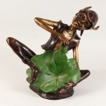 A TWO-COLOUR BRONZE PIXIE sitting on the floor with a leaf. 1ft 4ins high.