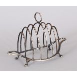 A VICTORIAN OVAL SIX-DIVISION TOAST RACK. London 1887.