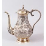 A FINE QUALITY INDIAN SOLID SILVER CALCUTTA COFFEE POT, decorated with traditional village scenes,