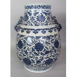 A LARGE CHINESE MING STYLE BLUE & WHITE PORCELAIN HU VASE, with moulded sprig handles, the base with