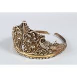 AN 18TH/19TH CENTURY INDIAN SILVER GILT TIARA, decorated with vine scrolls and two birds and head