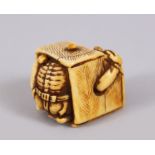 A 19TH CENTURY JAPANESE IVORY NETSUKE SHOKI in a rice box.