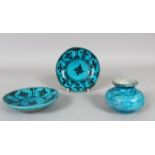 TWO 17TH CENTURY PERSIAN TURQUOISE GLAZED POTTERY SAUCERS and a similar ink pot, saucer 13cm