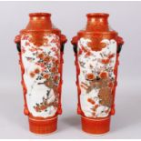 A GOOD PAIR OF KUTANI VASES painted with very good panels of birds and flowers, with lion mounts and