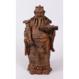 A FINE CHINESE WOOD AND GILT FIGURE DEPICTING A BEARDED CHINESE GOD, holding a Ruyi sceptre in one