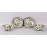 A LARGE PAIR OF CANTON CUPS AND SAUCERS, 11cm diameter, painted with brilliant coloured birds and