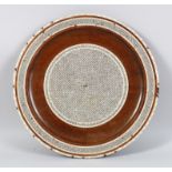 A PERSIAN MOTHER OF PEARL INLAID MOSAIC CIRCULAR WOODEN DISH, 40cm diameter.