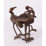 A SMALL JAPANESE BRONZE GROUP OF THREE BIRDS. 5cm high.