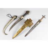 A MOROCCAN KUMAYA DAGGER and a North African brass dagger (2).