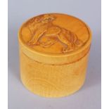 A GOOD JAPANESE IVORY LION LIDDED POT, prowling lion carved to the lid, 6.3cm high, 7.5cm diameter.
