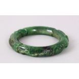 A CHINESE DARK GREEN BANGLE.