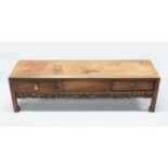A CHINESE REDWOOD LONG NARROW BASE, with plain top, two frieze drawers and a dummy drawer, pierced
