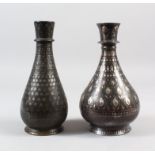 TWO EARLY 19TH CENTURY INDIAN BIDRI SILVER INLAID HUQQA BOTTLES, 20cm high.