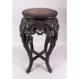 A GREAT QUALITY SLENDER CHINESE MARBLE TOP HARDWOOD STAND, the frieze and legs carved profusely with