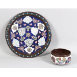 A SYRIAN DAMASCUS 19TH CENTURY CIRCULAR ENAMEL COPPER TRAY, 29cm diameter and a bowl, the sides