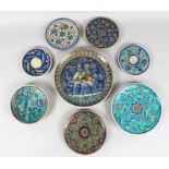 A COLLECTION OF EIGHT EARLY 20TH CENTURY JERUSALEM PALESTINIAN POTTERY PLATES, various sizes
