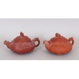 A GOOD PAIR OF 17TH/18TH CENTURY MOULDED ZISHA YIXING POTTERY TEAPOTS & COVERS, circa 1690, the