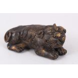 A BRONZE DOG OF FOE WEIGHT. 12cm long.