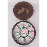 A CHINESE ENAMEL NINE PIECE HORS D'OEUVRES SET in a lacquer case. 29cm diameter.