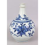 A GOOD EARLY ARITA BLUE AND WHITE BOTTLE VASE, painted with flowers. 27cm high.
