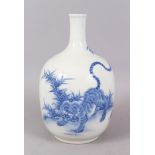 A GOOD 19TH CENTURY HIRADO BLUE AND WHITE BOTTLE VASE, decorated with tigers. 25cm high.