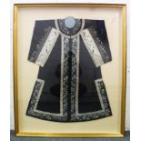 A SUPERB CHINESE SILK EMBROIDERED ROBE, framed and glazed.