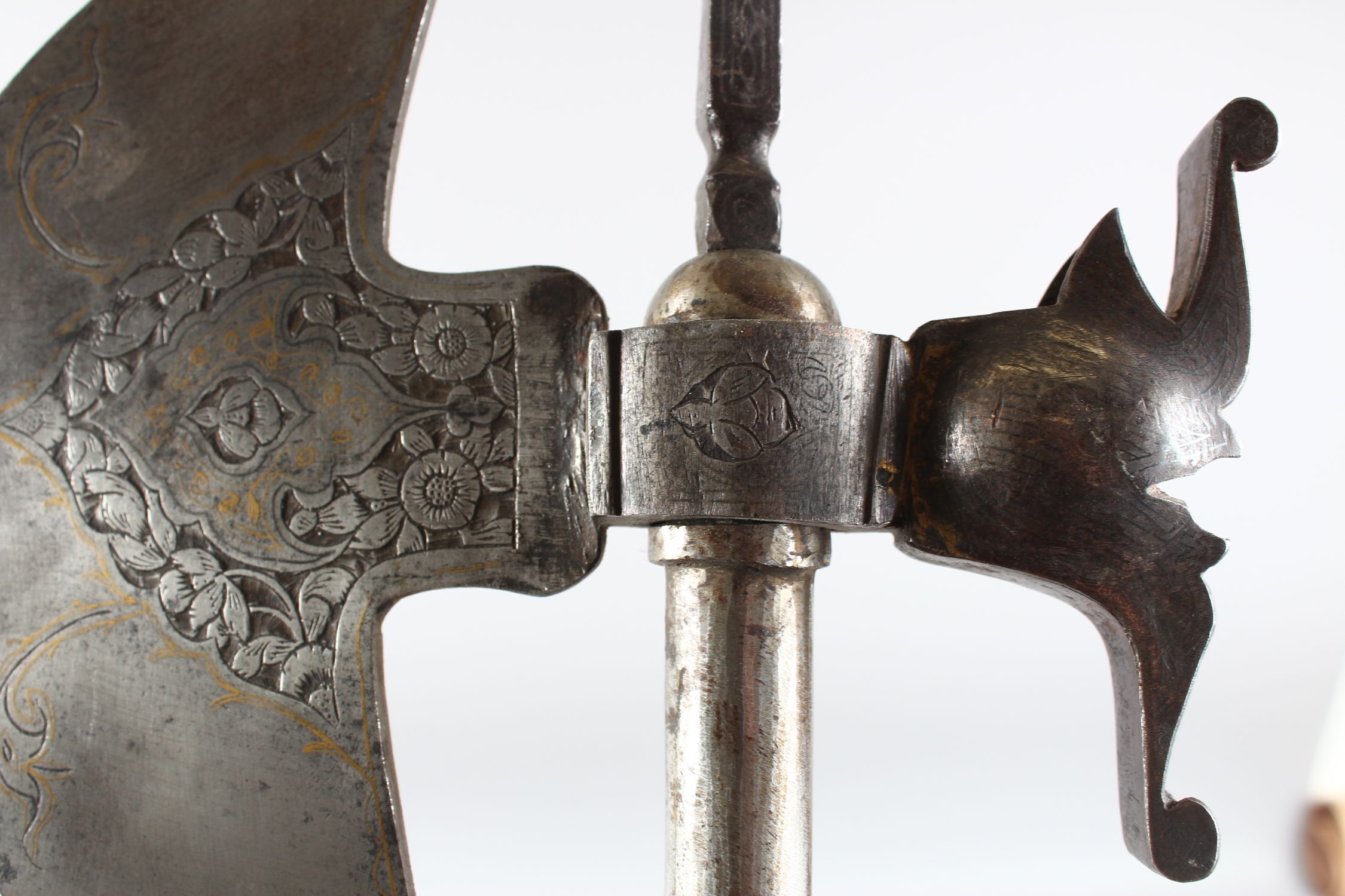 A 19TH CENTURY PERSIAN QAJAR GOLD INLAID STEEL AXE, 76cm long. - Image 2 of 3