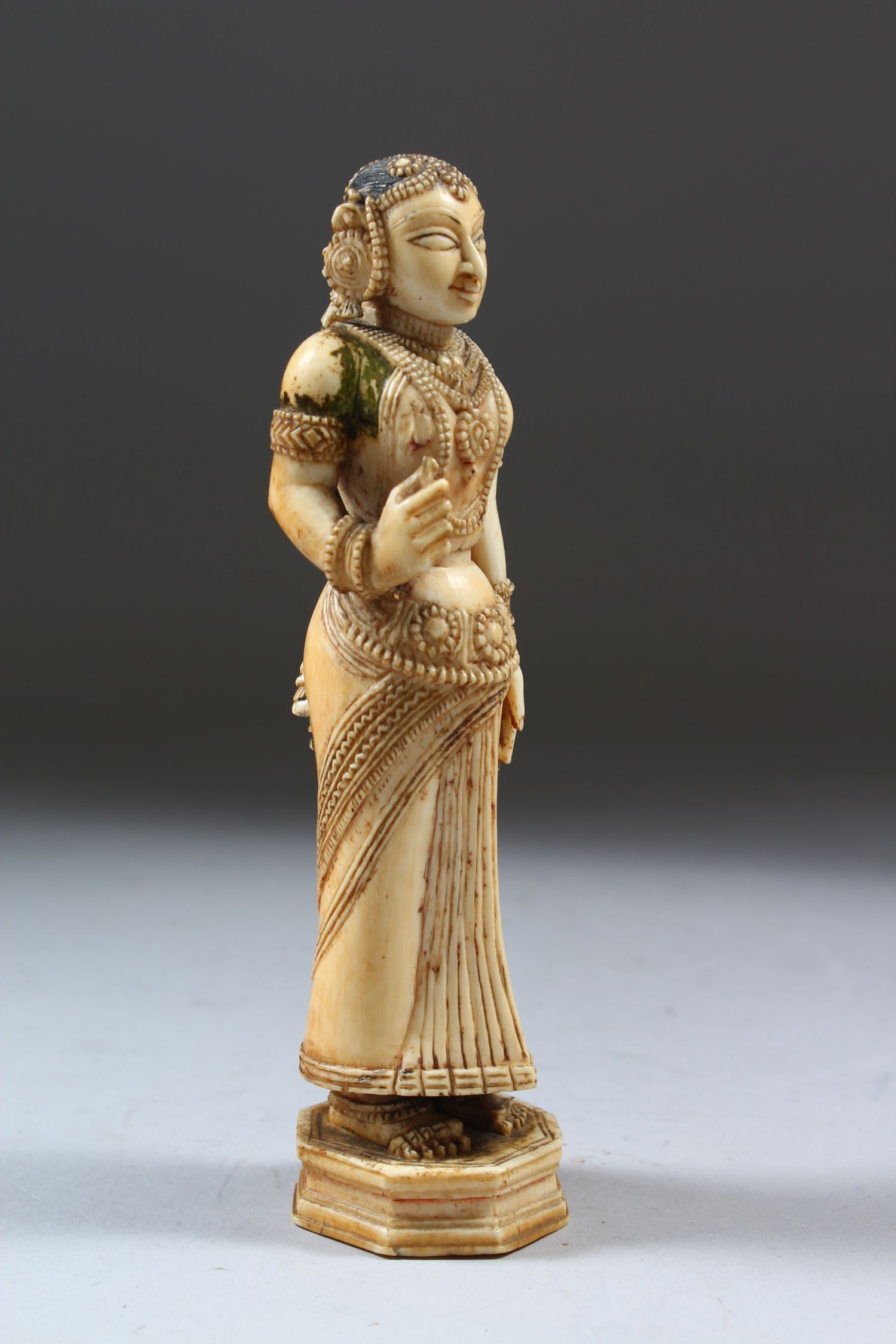 A 17TH-18TH CENTURY INDIAN POLYCHROME CARVED IVORY FIGURE of a young lady standing on an octagonal - Image 2 of 6