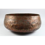 A LARGE CIRCA 15TH CENTURY MAMLUK COPPER BOWL EYGPT OR SYRIA with engraved band, 37cm diameter.