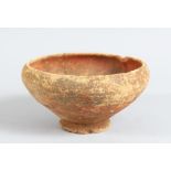 A 2000 YEAR OLD INDUS VALLEY CIRCULAR POTTERY BOWL, with traces of red and brown pigment, 12cm