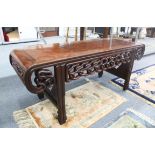 A LARGE CHINESE HARDWOOD OPIUM COFFEE TABLE, with pierced frieze and scroll end, late 19th century/