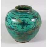 A PERSIAN TURQUOISE GLAZED POT, 17cm high.