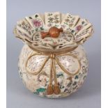 A JAPANESE SATSUMA CIRCULAR POT AND COVER, with wavy top, the sides with ribbons in gilt. 15cm