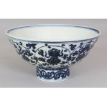 A CHINESE MING STYLE BLUE & WHITE PORCELAIN BOWL, supported on a relatively high foot, the sides