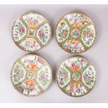 A SET OF FOUR CANTON CIRCULAR PLATES, painted with birds, figures, flower and butterflies. 24cm