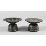 TWO INDIAN BIDRI SILVER INLAID HUQQA BOTTLES, CIRCA 1800, 7cm high, 11cm diameter.