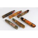 SIX 19TH-20TH CENTURY PERSIAN QAJAR QALAMDAN PAPIER MACHE PEN BOXES, mostly 20cm long.